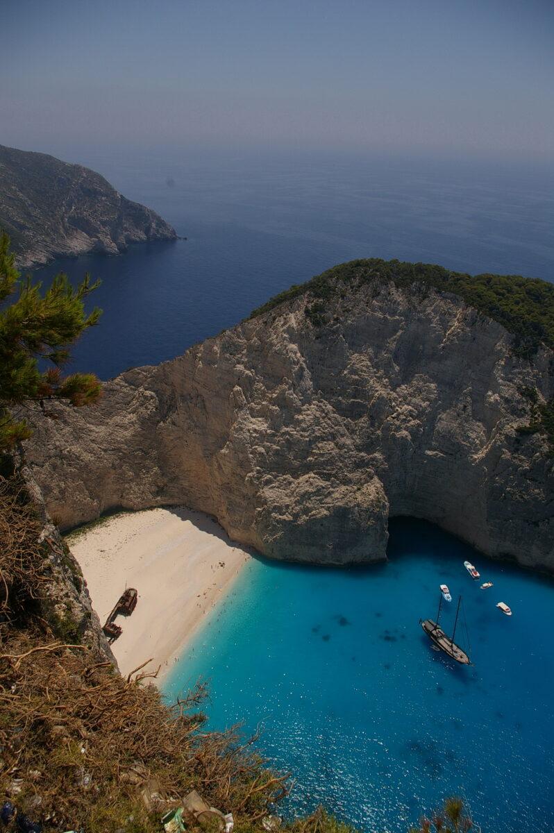 Zakynthos: Navagio beach, shipwreck in the center of the cove, limestone cliffs and turquoise sea