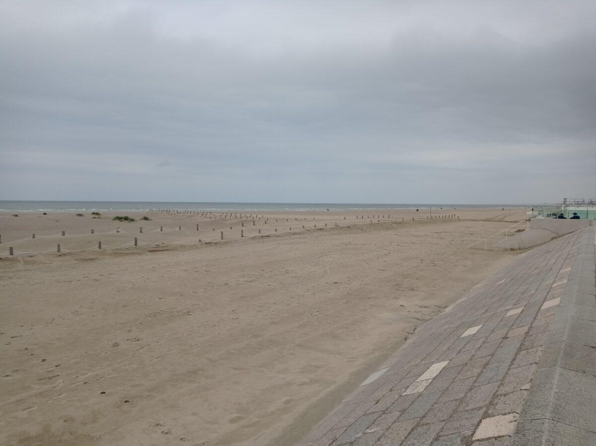 Malo-les-Bains beach in Dunkirk on a cloudy day, large fine sandy beach