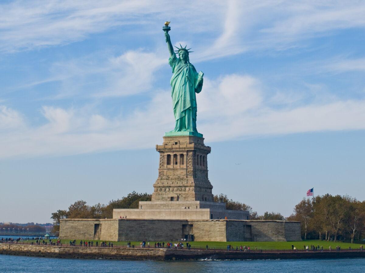 New York: the Statue of Liberty on Liberty Island under a blue sky