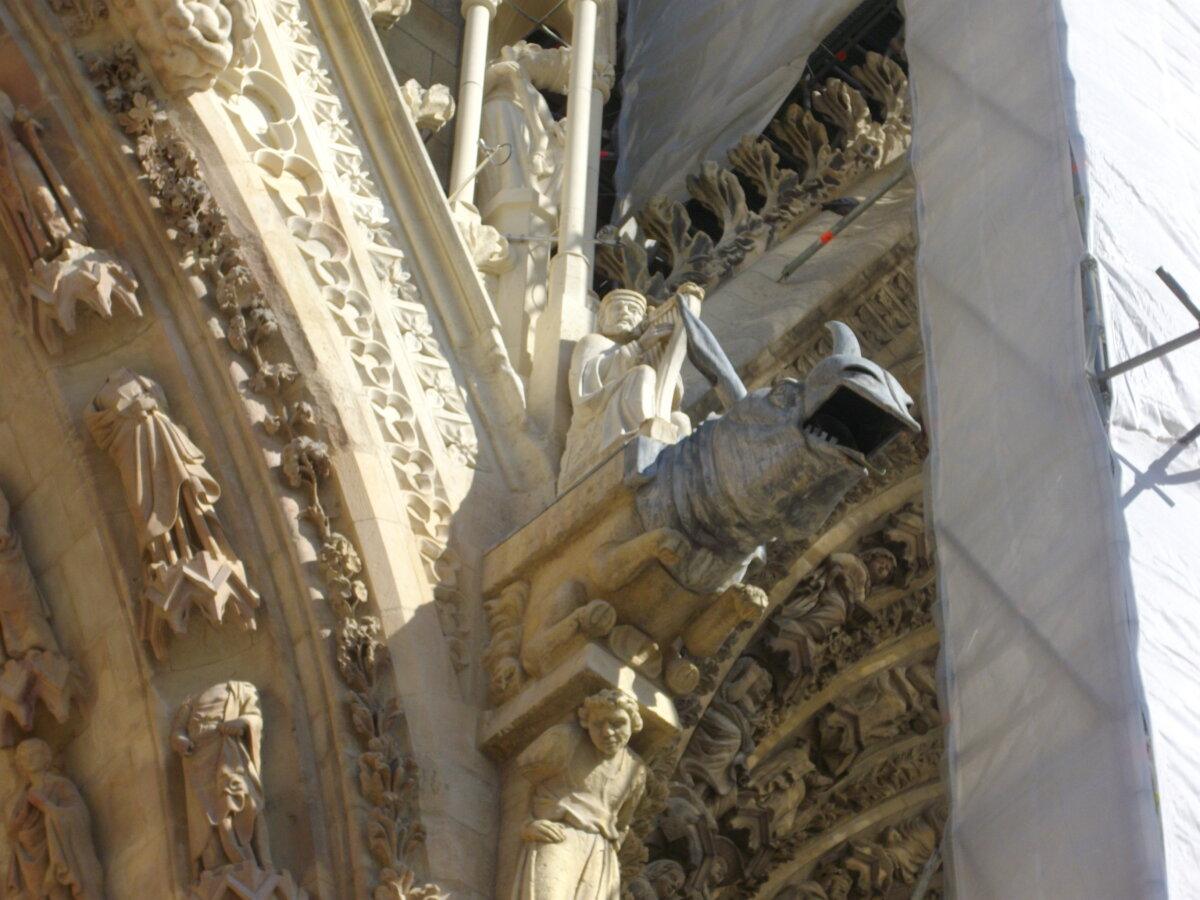 Detail of sculptures and gargoyles at the north portal of Reims Cathedral